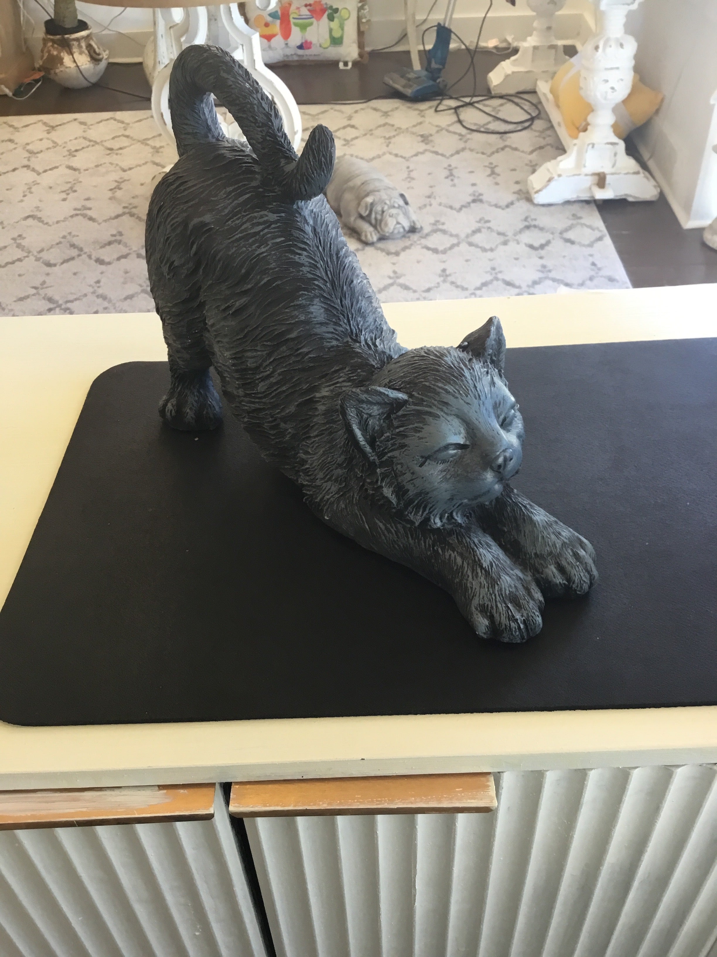 Stretching cat statue