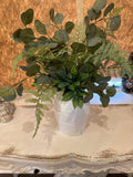 Greenery in white vase