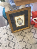 Blue and white jar w/ gold frame picture