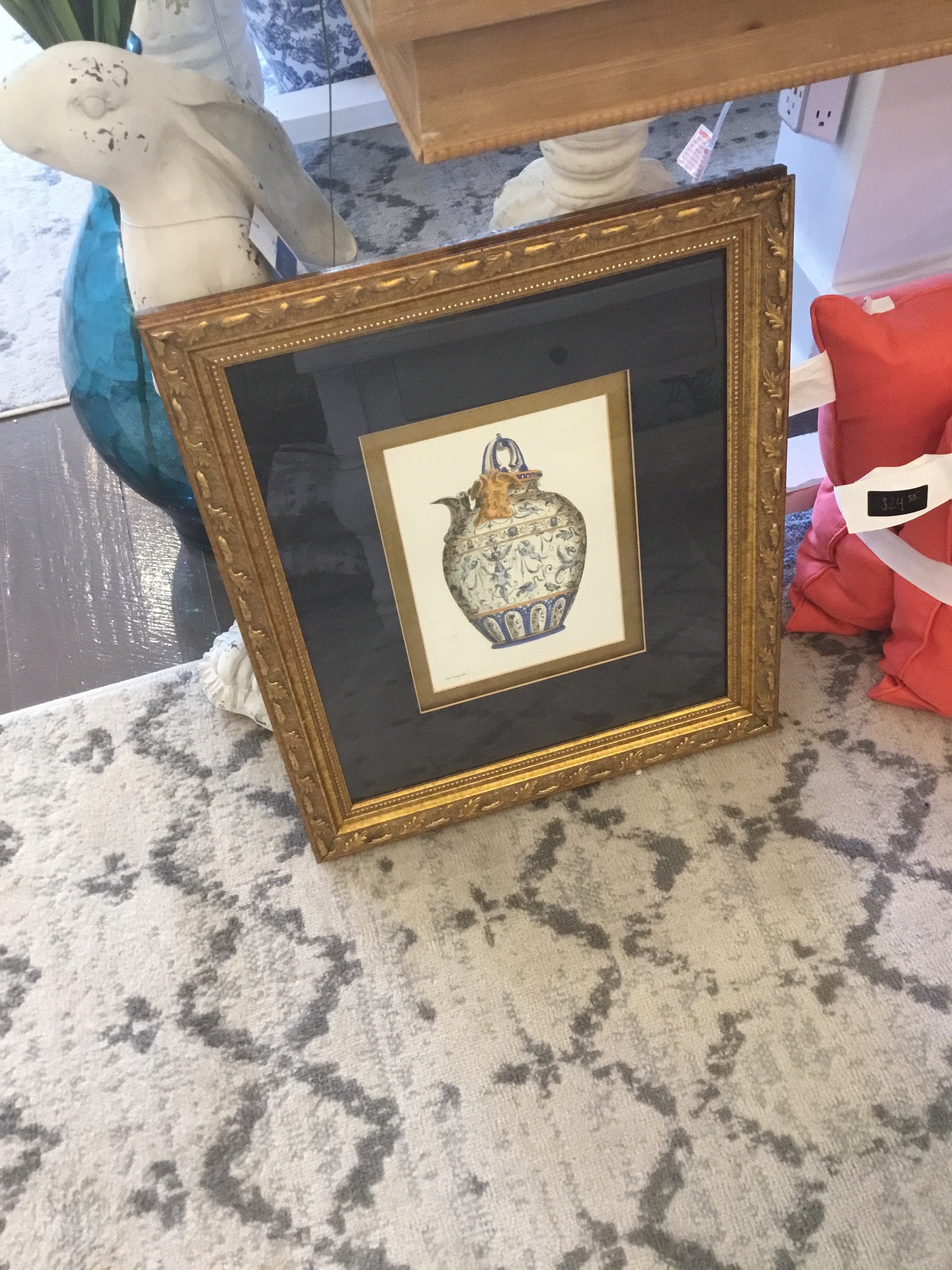 Blue and white jar w/ gold frame picture