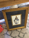 Blue and white jar w/ gold frame picture