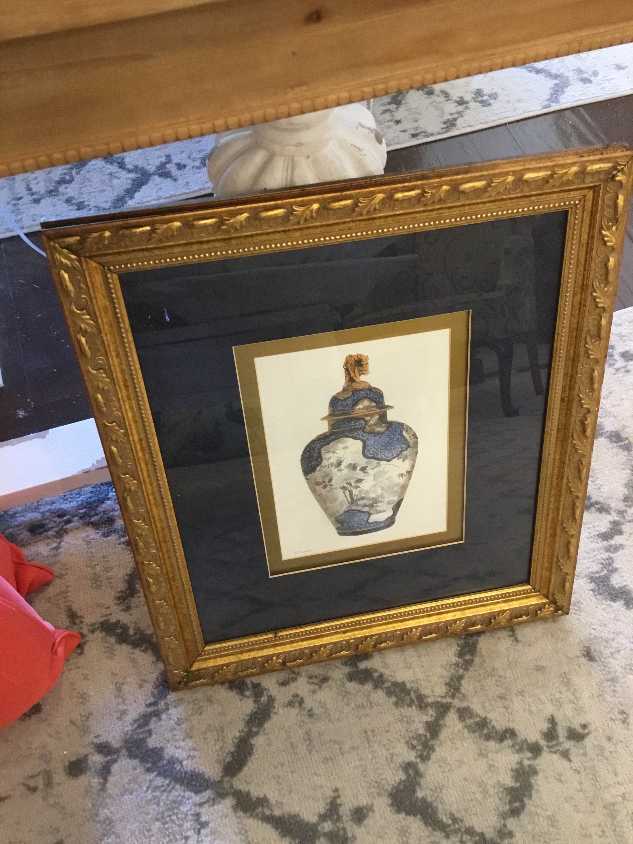 Blue and white jar w/ gold frame picture