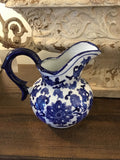 Small antique blue and white pitcher