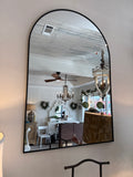 Small black curved mirror