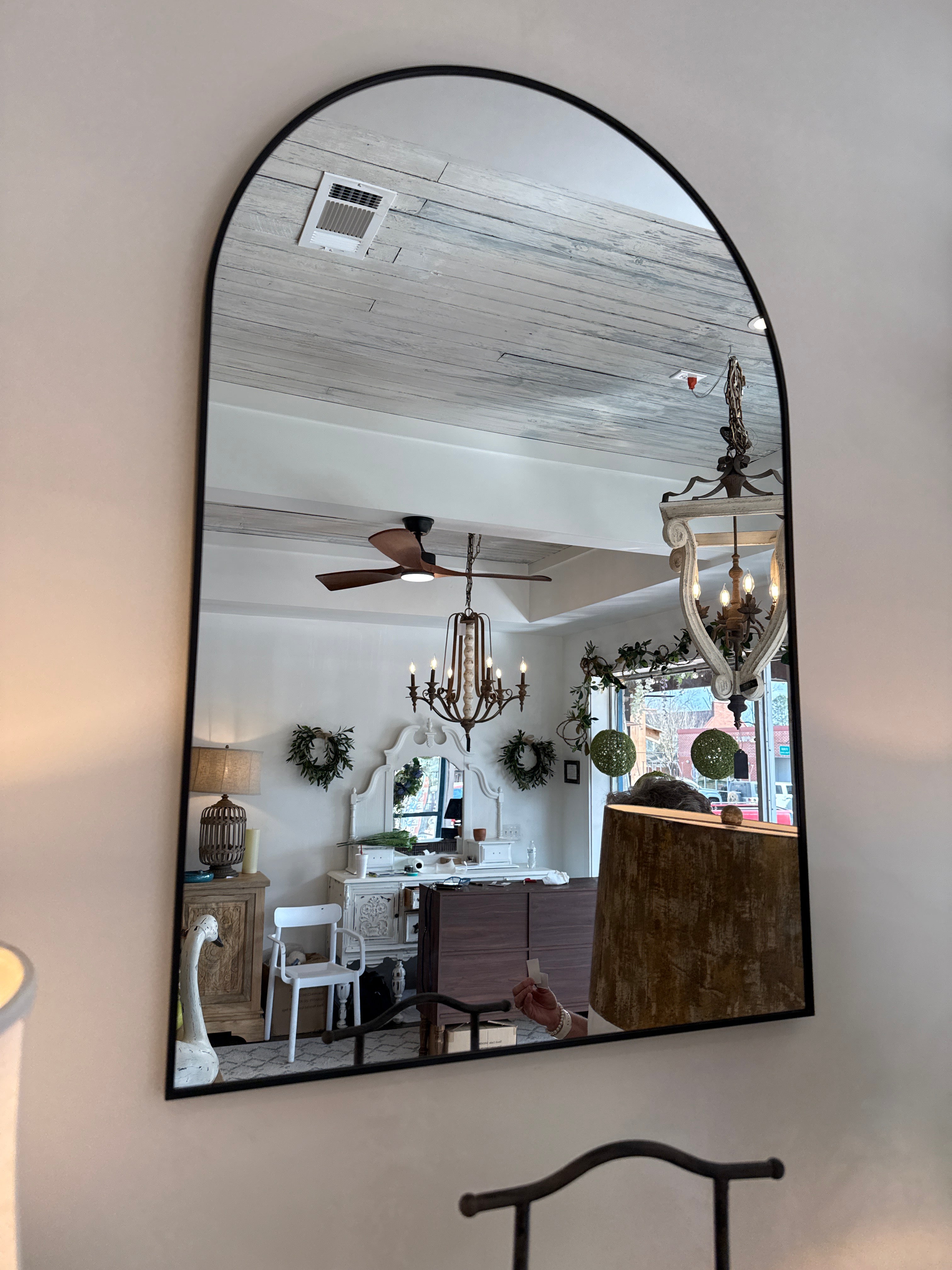Small black curved mirror